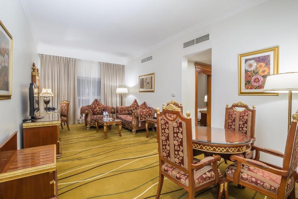 Well-lit corridor leading to guest rooms in Sunday Hotel Holiday International Dubai