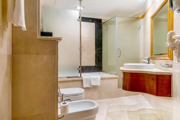 Spa treatment room with tranquil decor at Sunday Hotel Holiday International Dubai